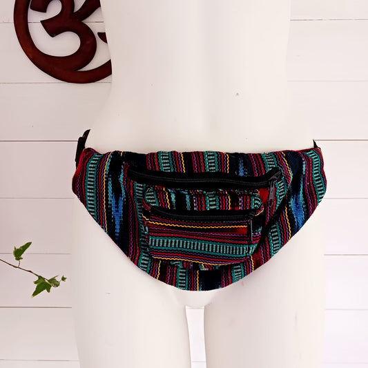 A festival favourite, these funky cotton Guatemalan bum bags come in mixed patterns. Each hip bag has three zipped compartments for organizing your valuables and a long adjustable belt strap with clasp. Perfect for holidays, the beach and festivals. Handmade and Fairtrade from Guatemala