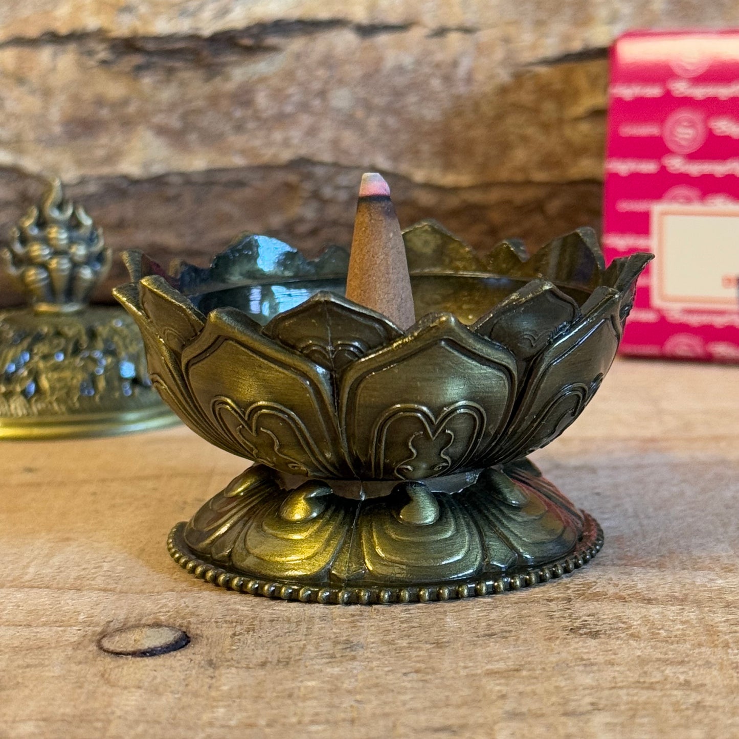 Enhance your home’s ambiance with this beautiful brass cone holder, thoughtfully designed in the shape of a lotus flower. Whether used for burning incense cones or as a charming decorative piece, this holder is both functional and elegant.
Key Features:
Elegant Lotus Design: The intricate lotus flower shape symbolizes purity and serenity, making it a meaningful addition to any space.
Majestic Smoke Display: Watch as the smoke gracefully curls through the lid’s opening, creating a soothing and captivating e