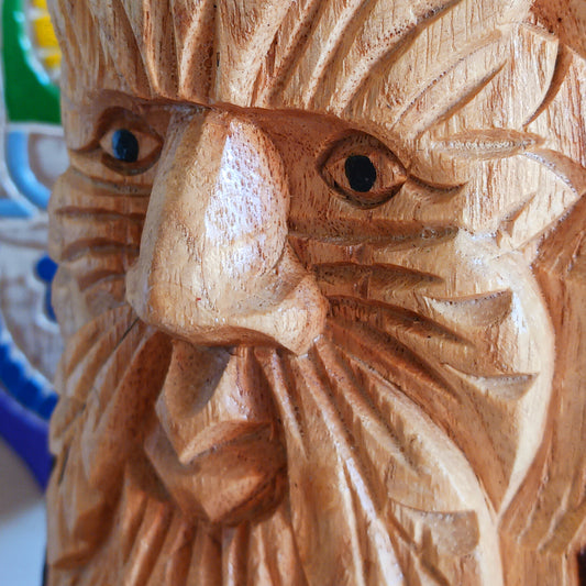 Bring the magic of ancient folklore into your home with these beautifully hand-carved Green Man wooden bookends. Celebrating one of the most enduring symbols of British and European mythology, the Green Man represents nature, renewal, rebirth and the changing seasons. His expressive face emerges from a crown of intricately carved leaves, creating a striking decorative feature for any bookshelf.