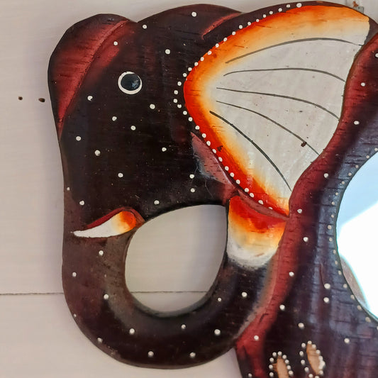 These beautiful little hand carved and hand painted mirrors depict an elephant with gorgeous dot painted detailing.  A cute little gift for elephant lovers!   Each mirror has a metal hoop on the reverse for ease of hanging.