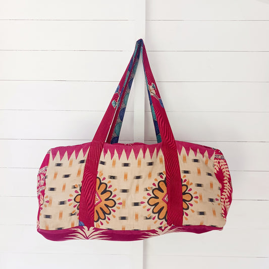 This summer holdall is an attractive accessory for weekends away with generous length handles, a zipped top and a useful front zipped pocket for mobile and keys. Each bag is one of a kind!