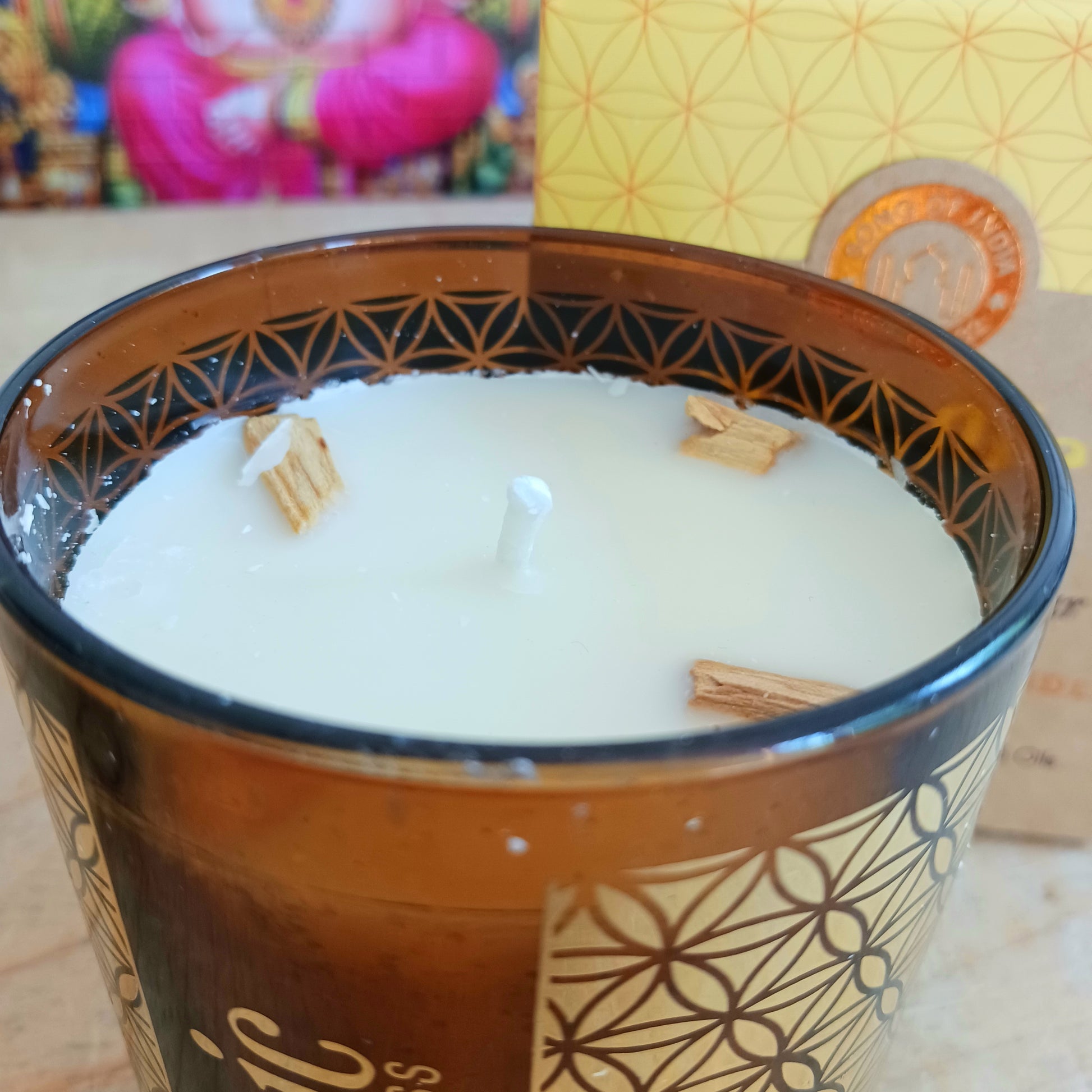 Song of India Organic Goodness soy wax candle, infused with natural smudge herbs and essential oils.  With the purifying and comforting aroma's of palo santo and cedarwood.
Hand poured in a decorative glass jar with flower of life pattern.