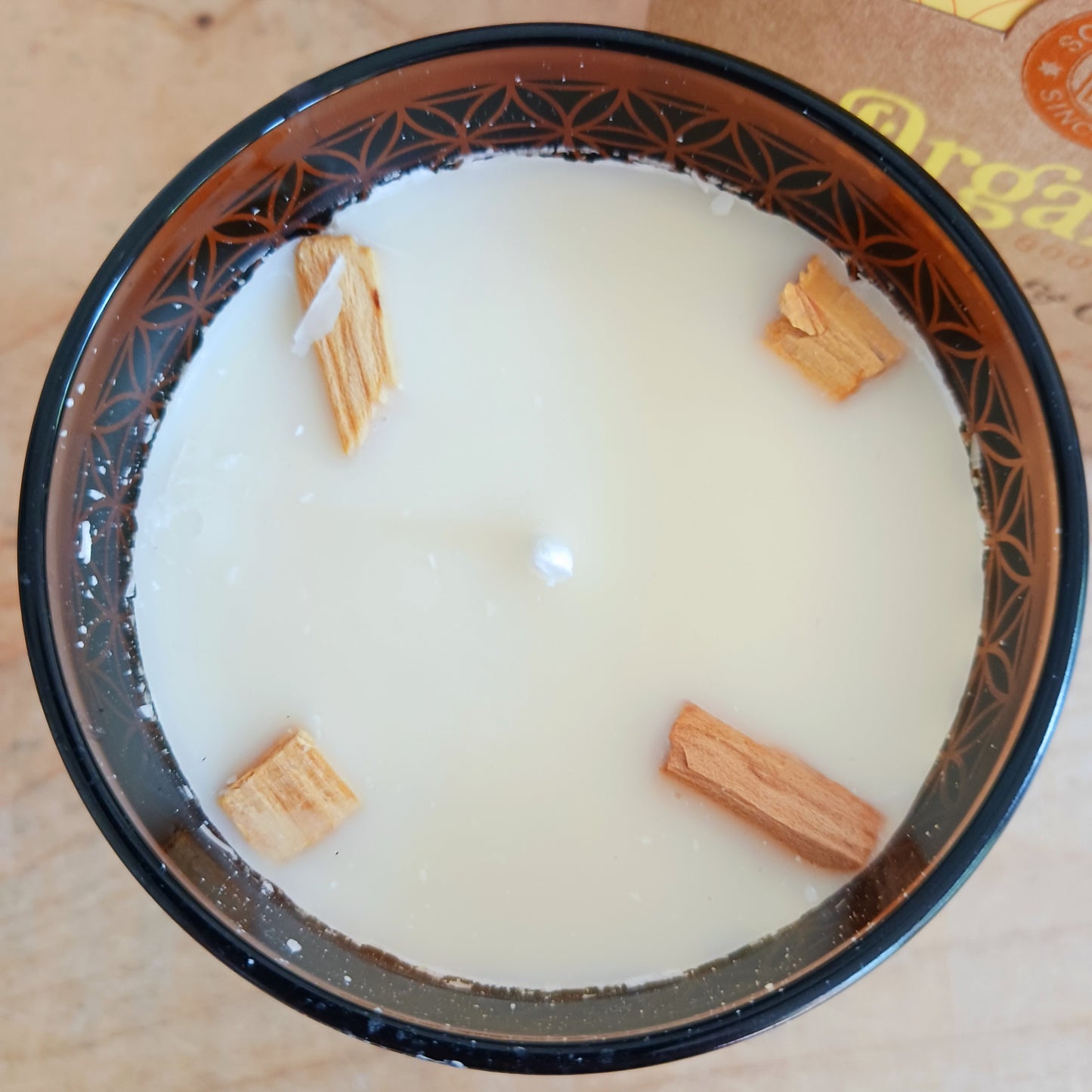 Song of India Organic Goodness soy wax candle, infused with natural smudge herbs and essential oils.  With the purifying and comforting aroma's of palo santo and cedarwood.
Hand poured in a decorative glass jar with flower of life pattern.