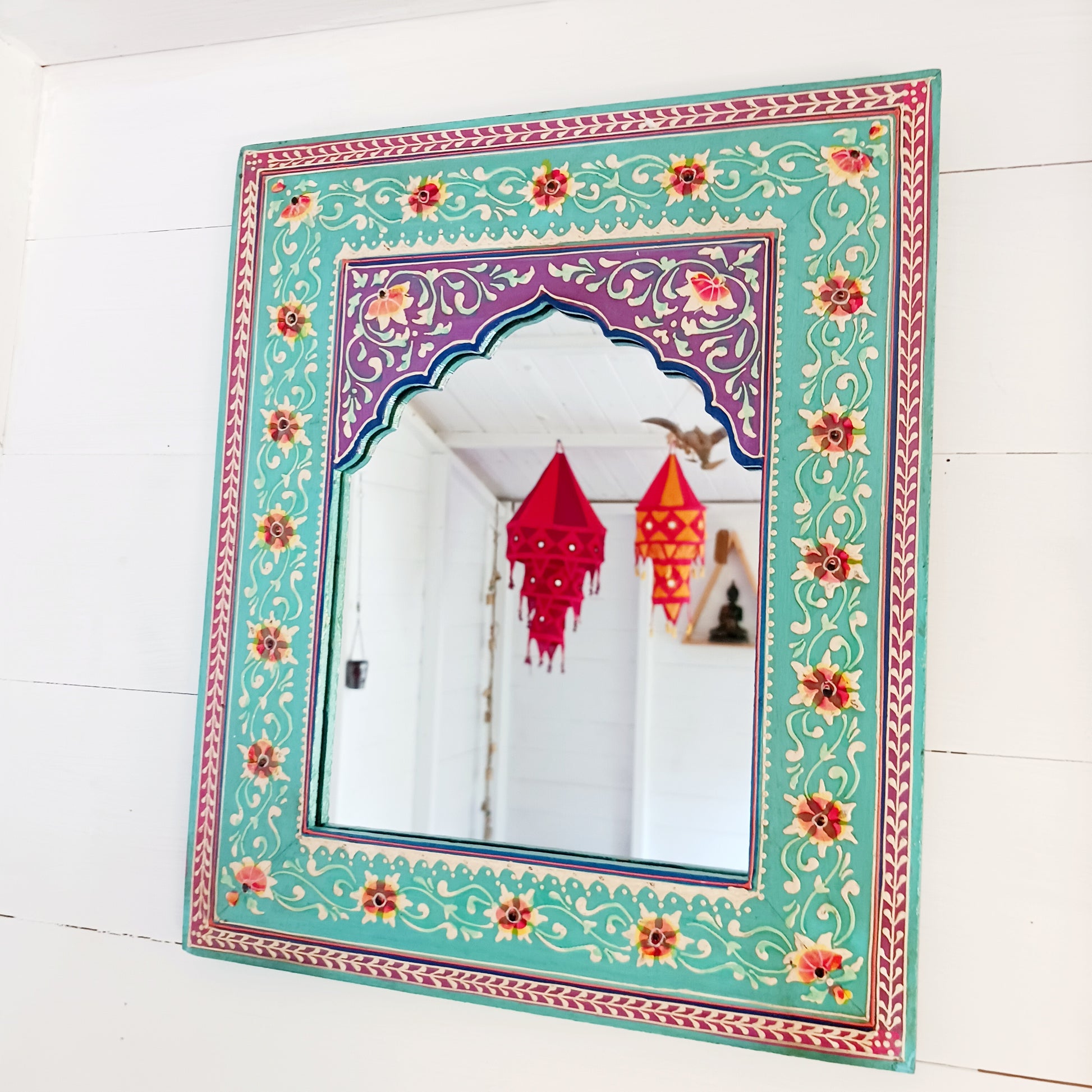 These beautiful Indian mirrors are made from sustainable mango wood and hand painted in a turquoise floral design.