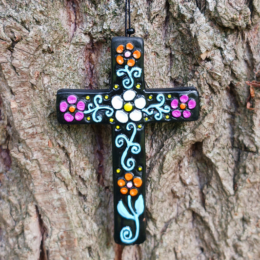 These pretty ceramic decorative crosses come in an assortment of colours with hand painted floral patterns of a traditional Peruvian style.
