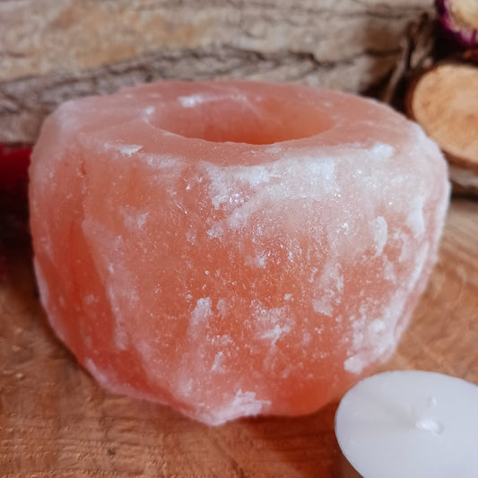 The tealight holders are made from chunks of Himalayan pink salt, which has a natural pink-red hue because of the minerals from which it’s formed. This gives off a soft, soothing pink glow when a tealight is shone through the rock.