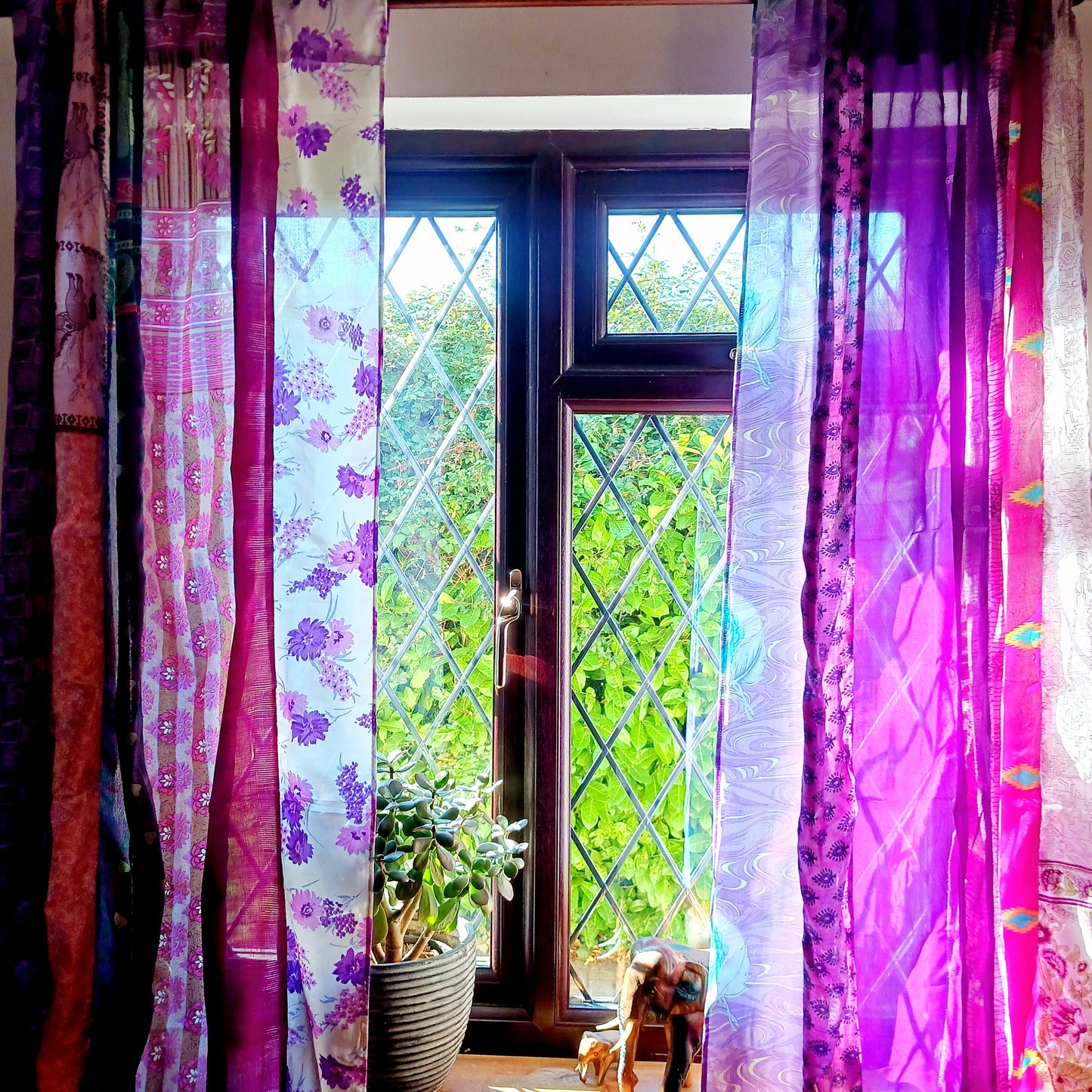 These beautiful curtains are handmade from assorted panels of Indian sari fabric, hand crafted into beautiful recycled curtain panels. The combined varieties of silky soft material are made with an easy to mount top hanging rod pocket.
