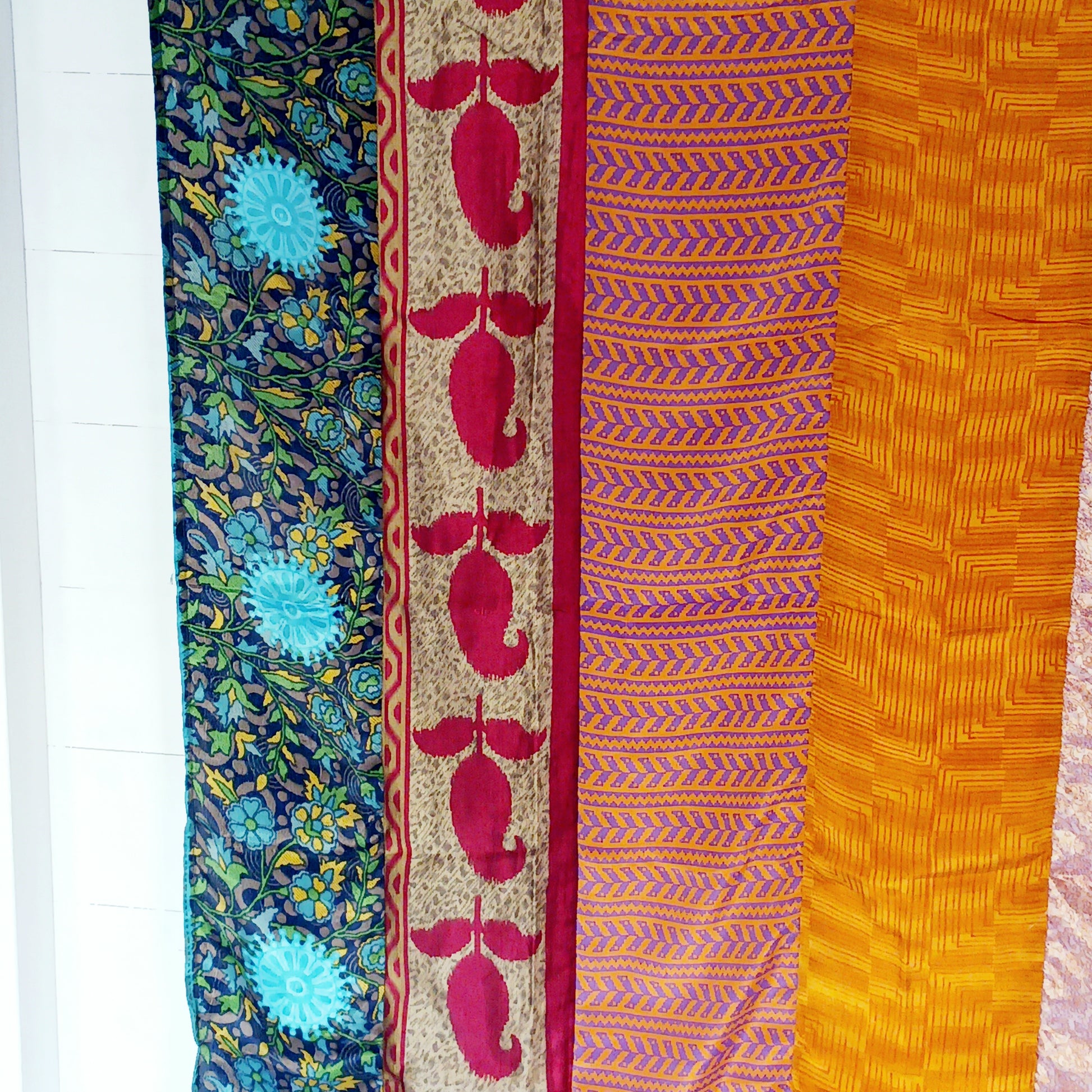 These beautiful curtains are handmade from assorted panels of Indian sari fabric, hand crafted into beautiful recycled curtain panels. The combined varieties of silky soft material are made with an easy to mount top hanging rod pocket.