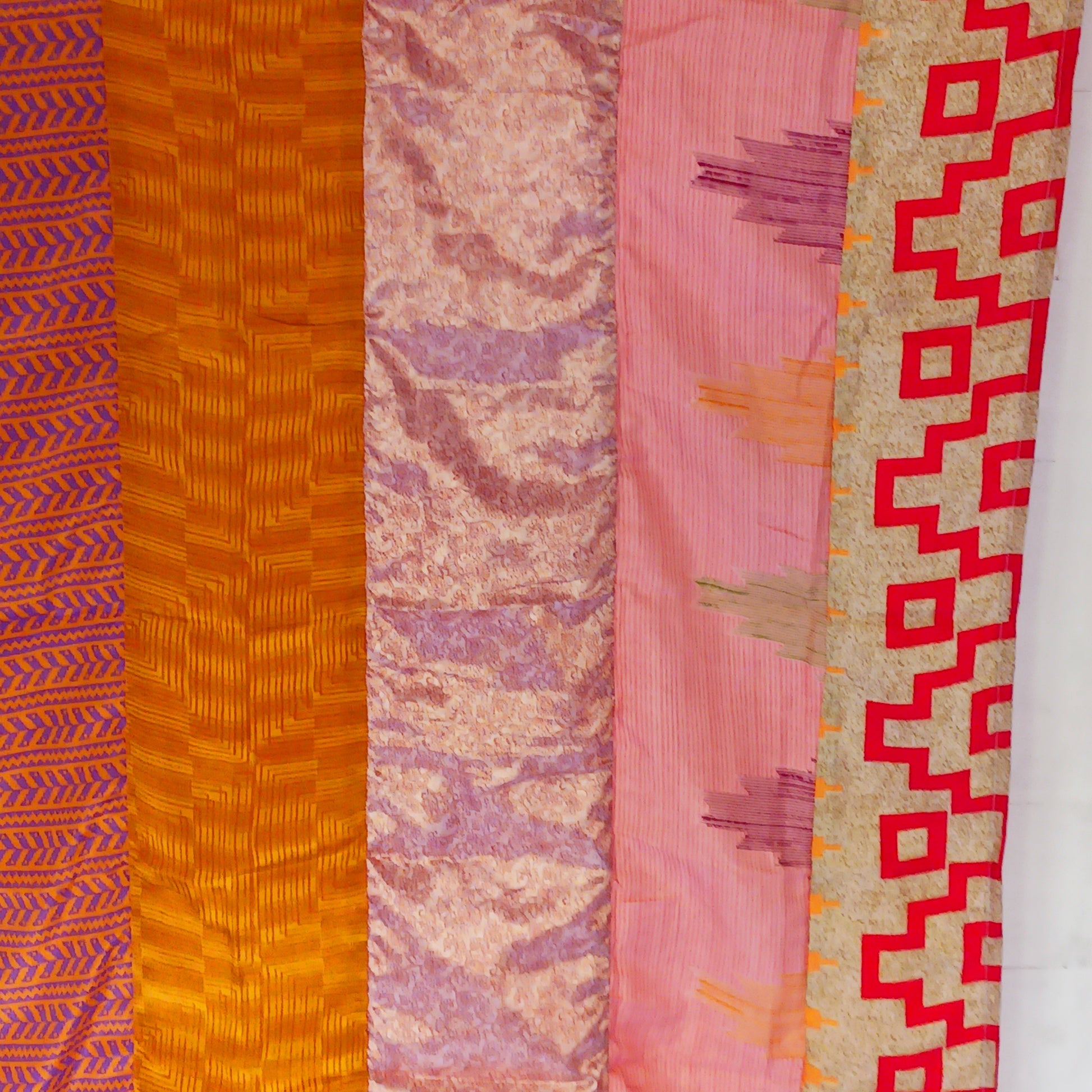 These beautiful curtains are handmade from assorted panels of Indian sari fabric, hand crafted into beautiful recycled curtain panels. The combined varieties of silky soft material are made with an easy to mount top hanging rod pocket.