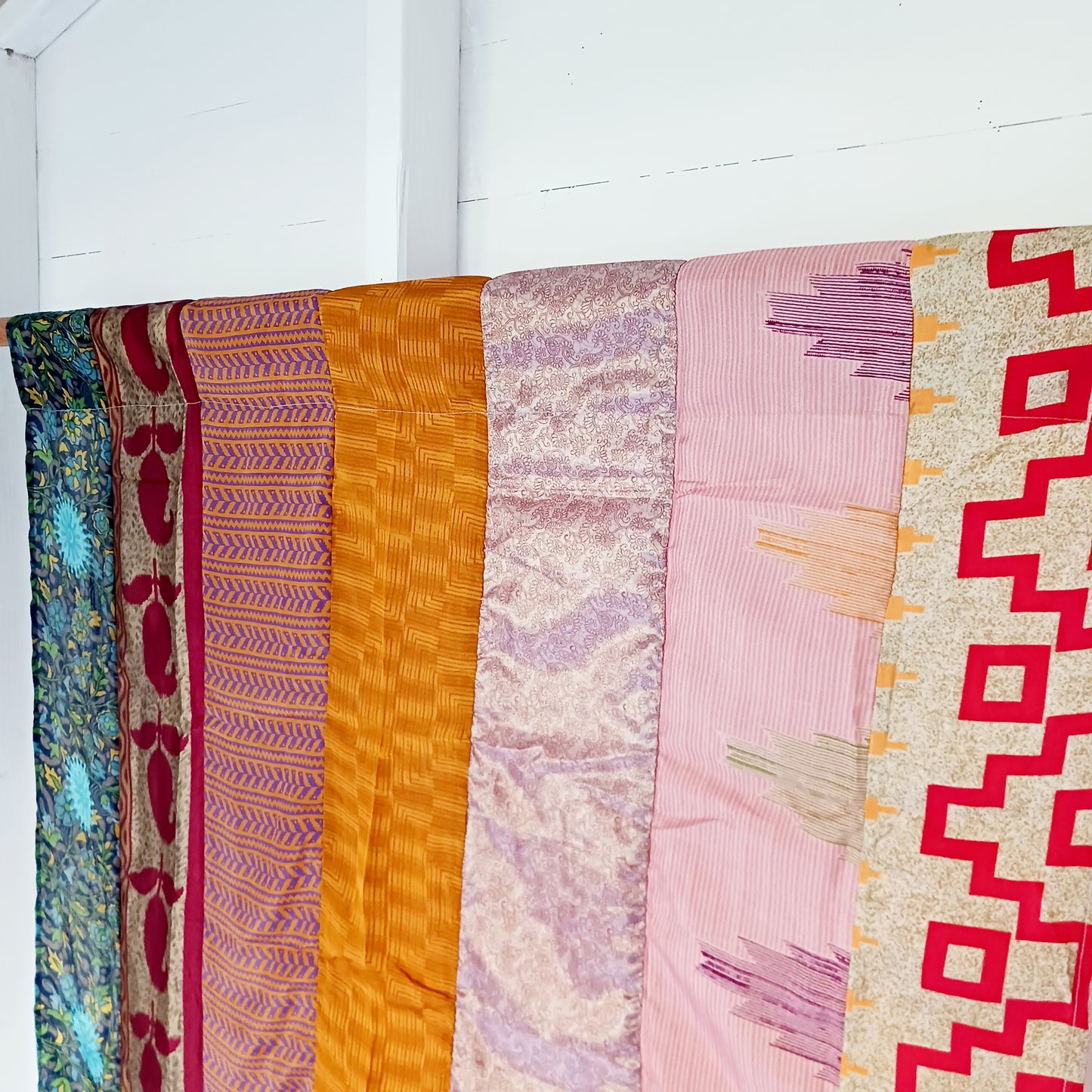 These beautiful curtains are handmade from assorted panels of Indian sari fabric, hand crafted into beautiful recycled curtain panels. The combined varieties of silky soft material are made with an easy to mount top hanging rod pocket.