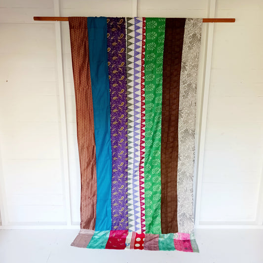 These beautiful curtains are handmade from assorted panels of Indian sari fabric, hand crafted into beautiful recycled curtain panels. The combined varieties of silky soft material are made with an easy to mount top hanging rod pocket.