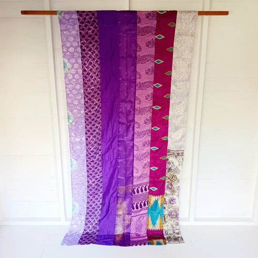 These beautiful curtains are handmade from assorted panels of Indian sari fabric, hand crafted into beautiful recycled curtain panels. The combined varieties of silky soft material are made with an easy to mount top hanging rod pocket.