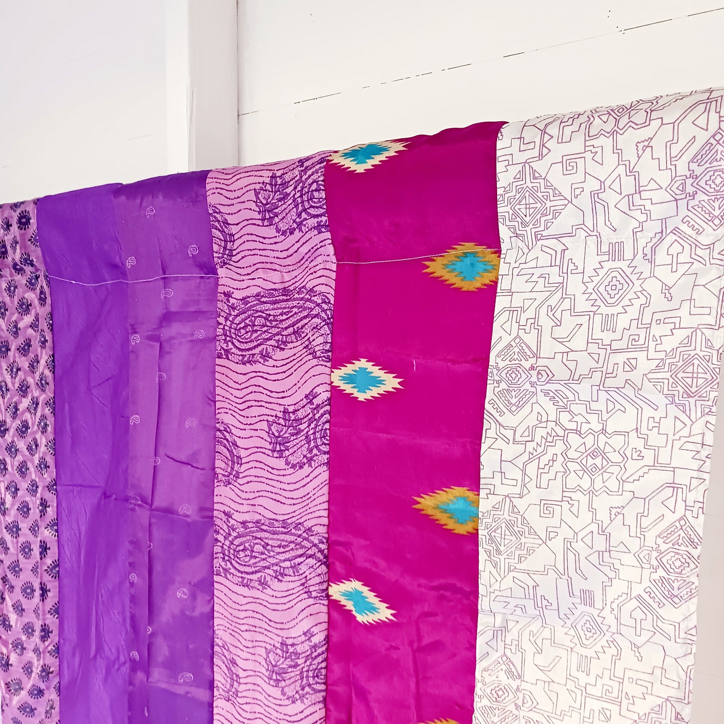 These beautiful curtains are handmade from assorted panels of Indian sari fabric, hand crafted into beautiful recycled curtain panels. The combined varieties of silky soft material are made with an easy to mount top hanging rod pocket.