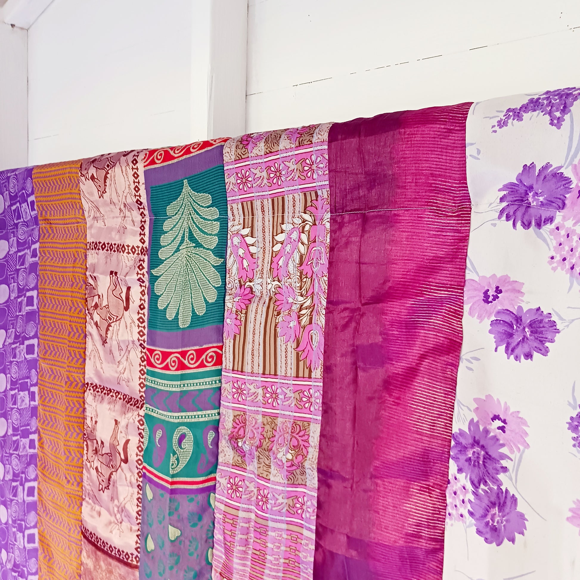 These beautiful curtains are handmade from assorted panels of Indian sari fabric, hand crafted into beautiful recycled curtain panels. The combined varieties of silky soft material are made with an easy to mount top hanging rod pocket.