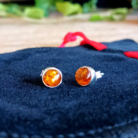 These perfect Silver Amber Stud earrings are minimal and modern jewellery box must-have! 
Handcrafted with beautiful large Amber gemstones, the stones are set within simple sterling silver frames, adding a modern and elegant touch to the natural centrepiece.  Each Amber gemstone boasts a classic cut, with dome top and perfect polish. 
Approx size 5mm