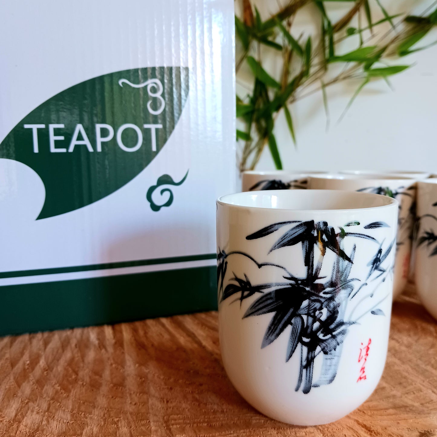 This beautiful Oriental Herbal Teapot Set is made in a ceramic white stone Oriental bamboo design. Packed in a gift box, a teapot with a metal strainer in the lid, a detachable handle and six matching little cups.