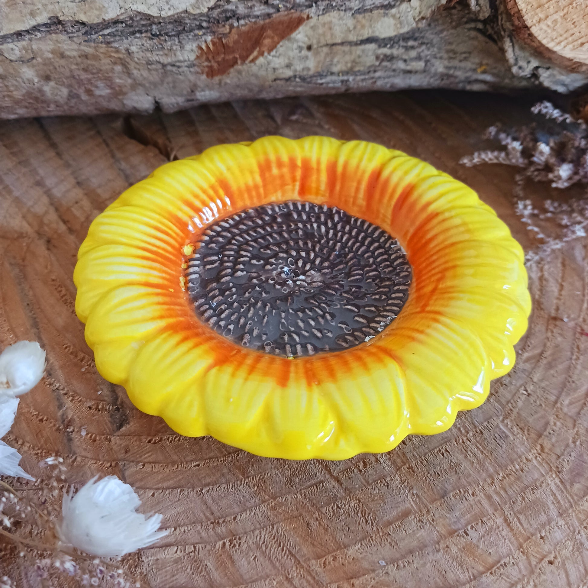 Refresh your senses with this pretty ceramic incense holder shaped like a classic sunflower. Bright and cheerful, this ceramic holder will look charming on a side table or nightstand while catching falling ash.