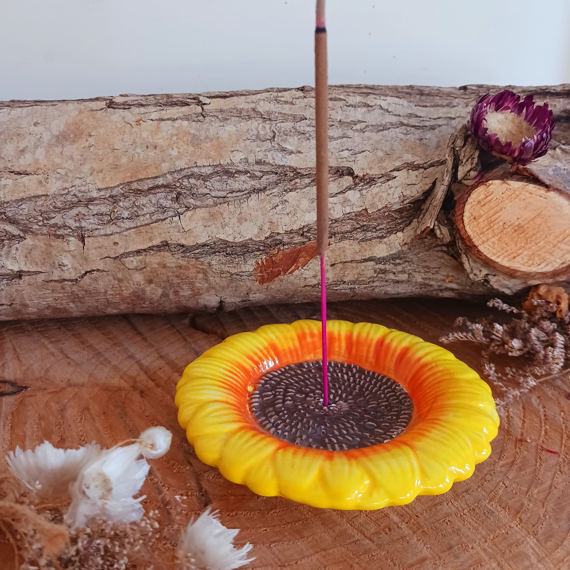 Refresh your senses with this pretty ceramic incense holder shaped like a classic sunflower. Bright and cheerful, this ceramic holder will look charming on a side table or nightstand while catching falling ash.