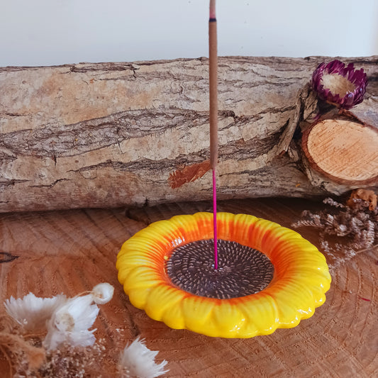 Refresh your senses with this pretty ceramic incense holder shaped like a classic sunflower. Bright and cheerful, this ceramic holder will look charming on a side table or nightstand while catching falling ash.