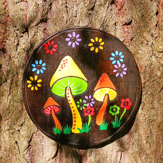 Add a touch of fungi fun to your wall space with this adorable Mushroom Wall Plaque! With its cheerful smile and handy hook, this handmade and Fairtrade beauty from Indonesia is sure to bring a smile to your face.