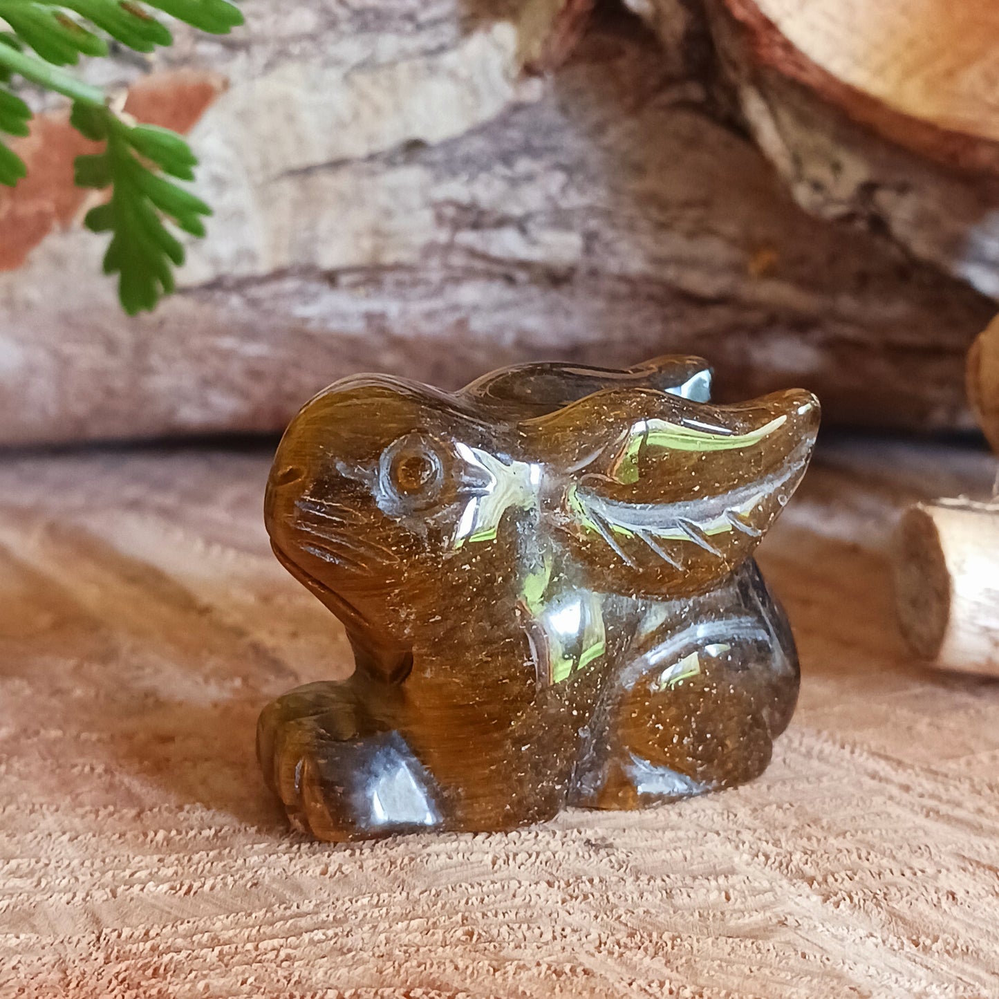 This cute little golden Tigers Eye rabbit has been hard carved from the stone with unique markings reminiscent of rich gold brown fur. As these are hand carved, each bunny is unique and individual.