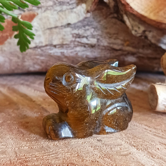 This cute little golden Tigers Eye rabbit has been hard carved from the stone with unique markings reminiscent of rich gold brown fur. As these are hand carved, each bunny is unique and individual.