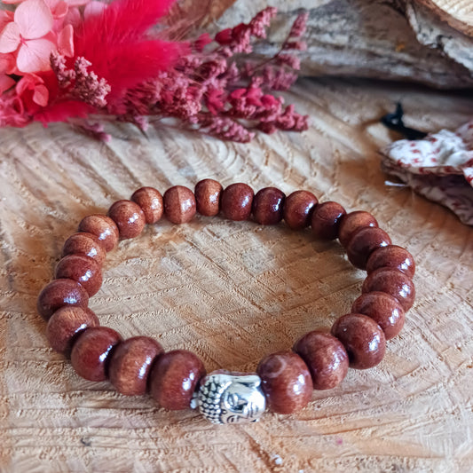 This simple wooden beaded bracelet is made from natural wood beads in a variety of sizes. The beads are strung together on a sturdy cord and in the centre is the face of Buddha.
The bracelet is gifted in a traditional Tibetan pouch.
Handmade and Fair Trade from Indonesia.
Size: Beads are approximately 5mm, one size fits all