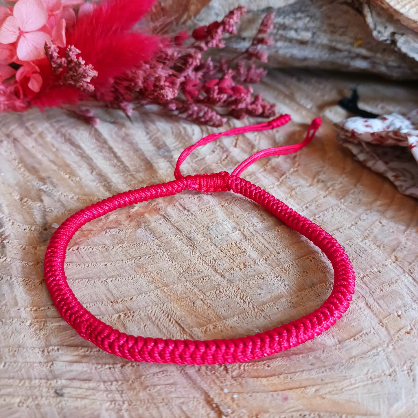 This red Tibetan handmade knot rope bracelet is made with good quality braided cord, durable and last long time, super light, safe and comfortable to wear. One size but adjustable size make it suit anyone to wear.