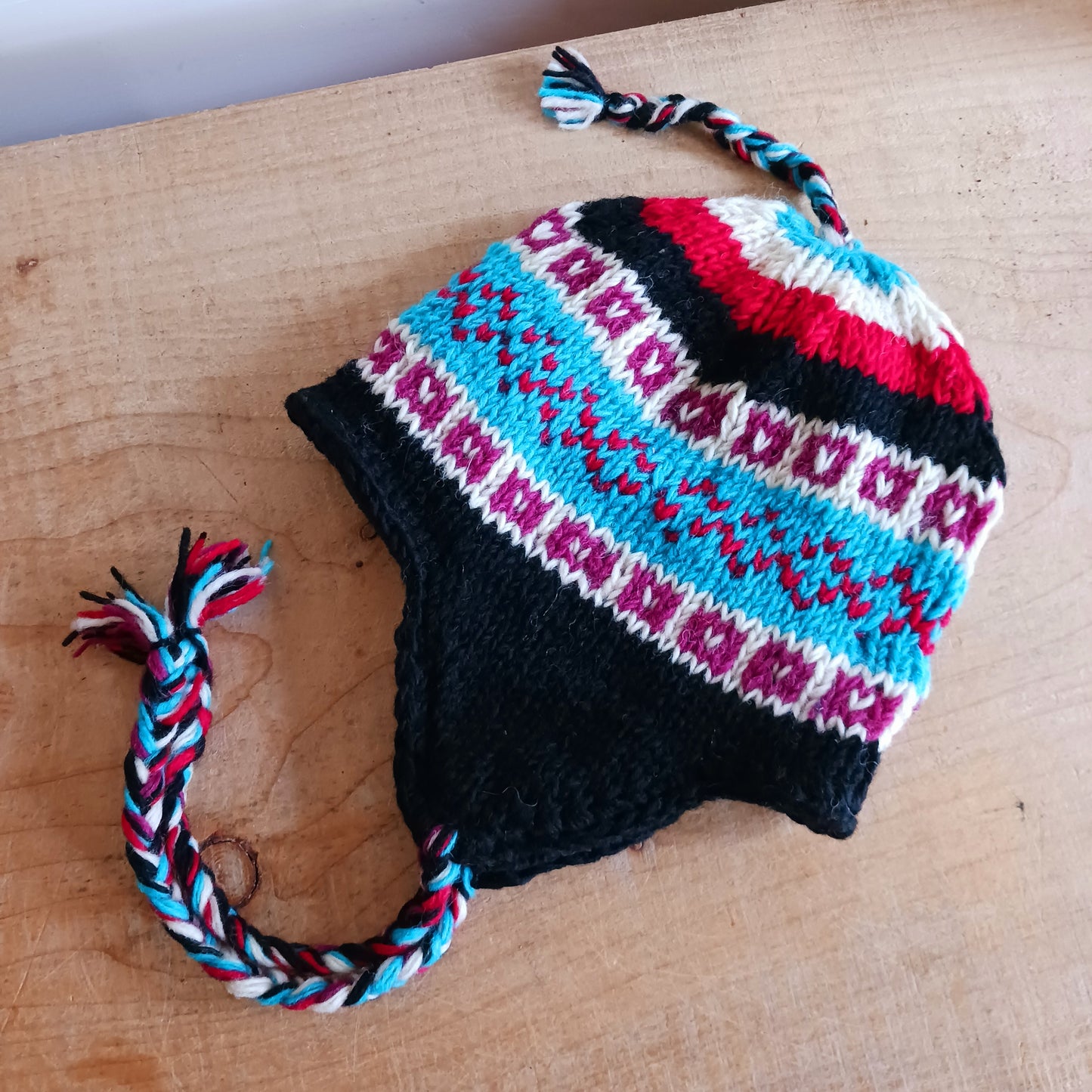 Chunky wool earflap hats hand made in Nepal with fleece lining for extra warmth and comfort, this handmade hat is awesomely warm.