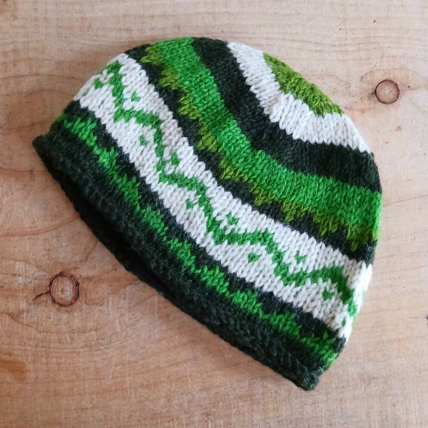 Chunky wool beanie hats hand made in Nepal with fleece lining for extra warmth and comfort, this handmade hat is awesomely warm. These knitted beanie hats have a rolled brim, a warm lined interior and are available in mixed colours.