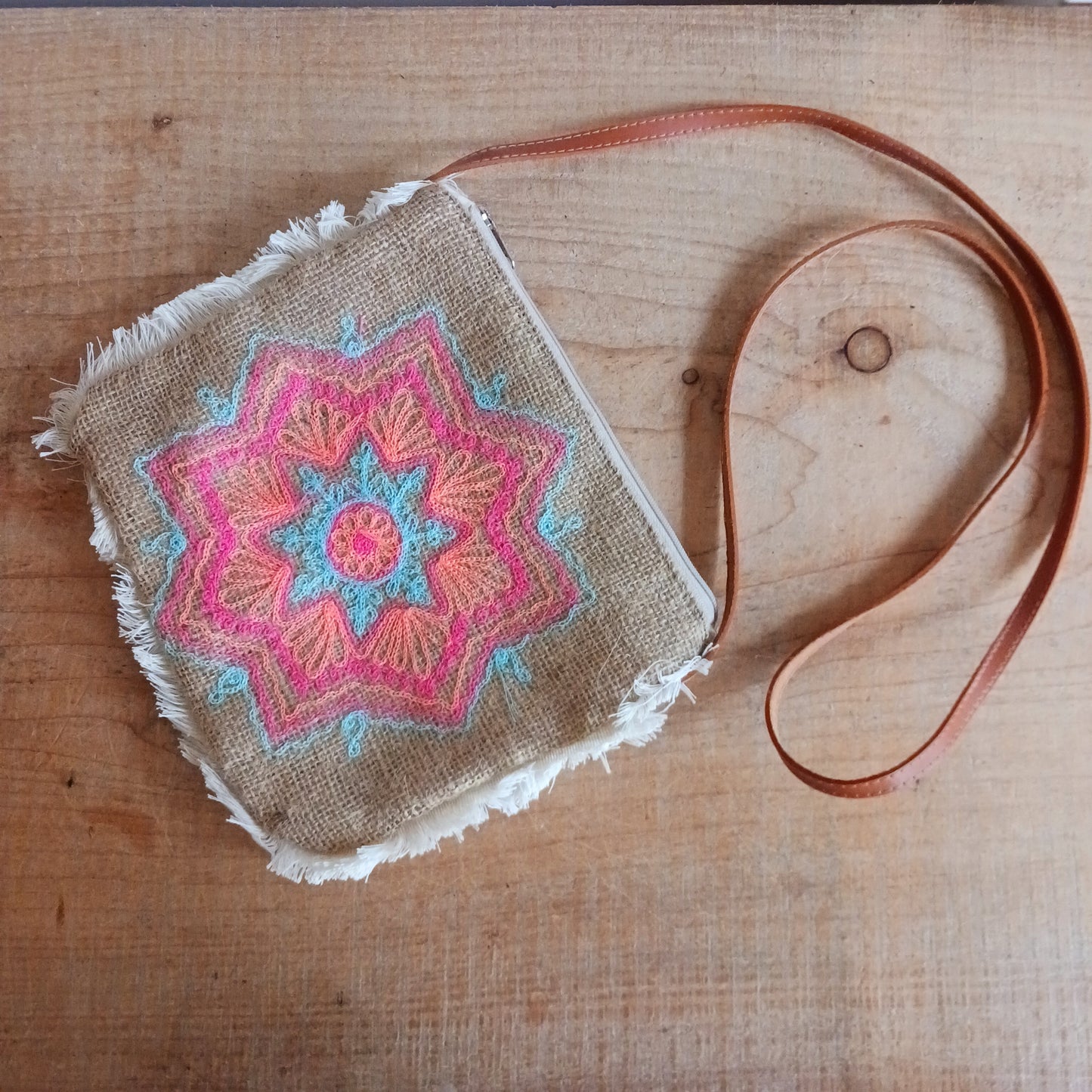 These unique and lovely bags have mandala patterns on smooth jute that has been washed with fashionable prints that are either printed or sewn onto it, and finished with a fringe. Handmade by a Balinese family business, these bags are carefully sewn by hand with intricate details.
