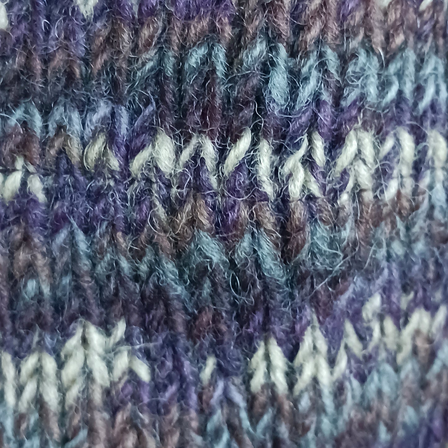 This Hasri space dye earflap hat is a fun and snuggly hat with matching pom poms. Chunky knit from tie dye wool with a smooth fleece lining so it's lovely and comfortable to wear and keep you extra warm. Perfect for winter days out!