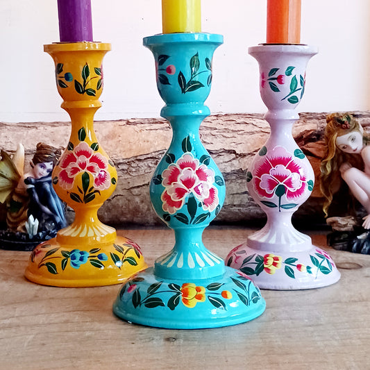 These beautifully hand crafted Kashmiri candle holders have been hand painted in vibrant, decorative colours of pink, yellow and turquoise. These unique candlesticks will fill any space with elegant grandeur. Intricate flower petals and delicate foliage are finished to a high shine glaze to boost the intensity of a captivating design.