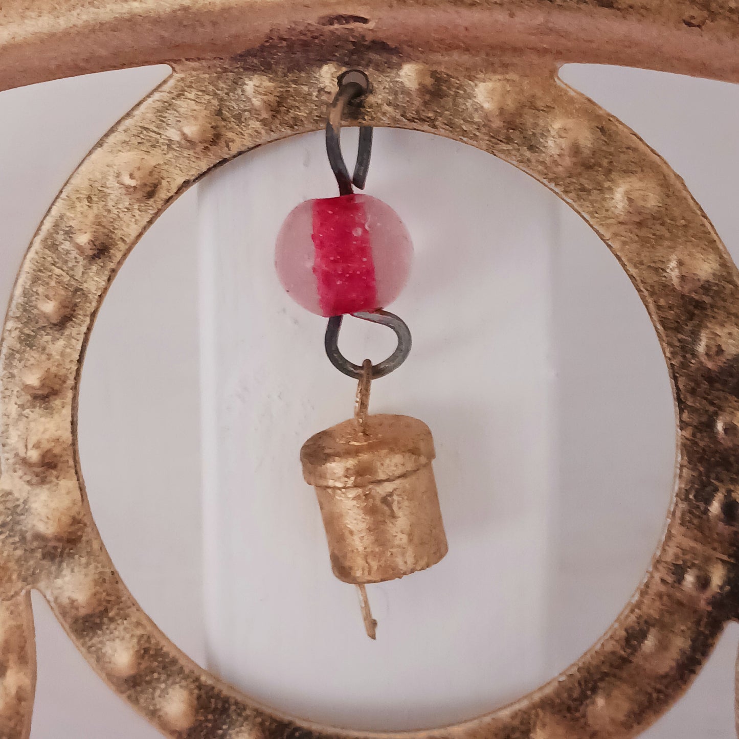 Enhance your living space with this beautiful large Buddha face 15 bell chimes. This lovely brass decoration exudes serenity and spiritual charm. An intricate piece featuring a serene Buddha face surrounded by delicate circular accents and vibrant, colourful beads. With 15 brass bells, this chime creates a harmonious, soothing sound, making it ideal for both indoor and outdoor spaces.