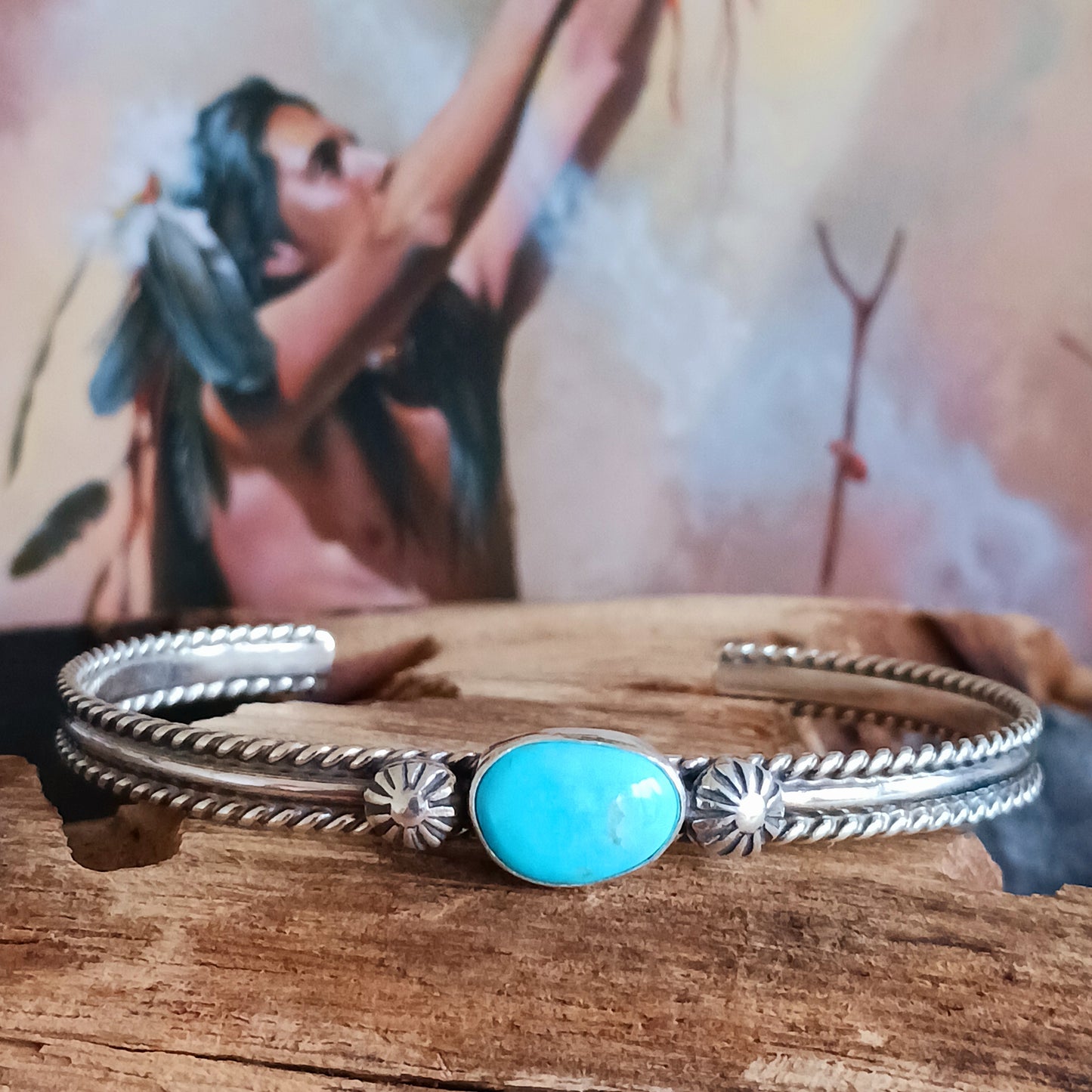 This beautiful and elegant Kingman Turquoise bracelet has been handmade by Navajo artisan Ben Jimenez. The finely crafted silver band is complemented by a stunning Turquoise stone at the centre. This is the artistry of Ben Jimenez who has developed such a distinctive style.