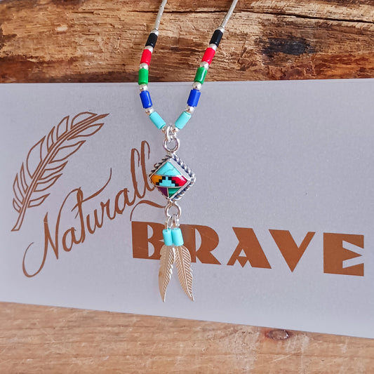 This stunning Aztec Necklace is both chic and cool. It has liquid silver chain with Aztec beads, the centrepiece is an Aztec diamond and from this hang two silver feathers, a symbol of warrior strength.