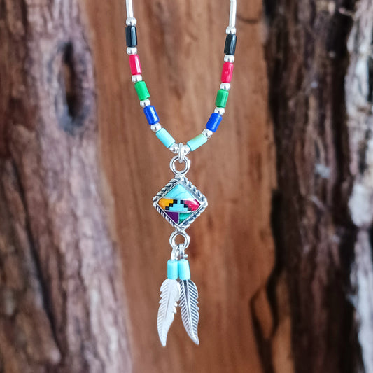 This stunning Aztec Necklace is both chic and cool. It has liquid silver chain with Aztec beads, the centrepiece is an Aztec diamond and from this hang two silver feathers, a symbol of warrior strength.