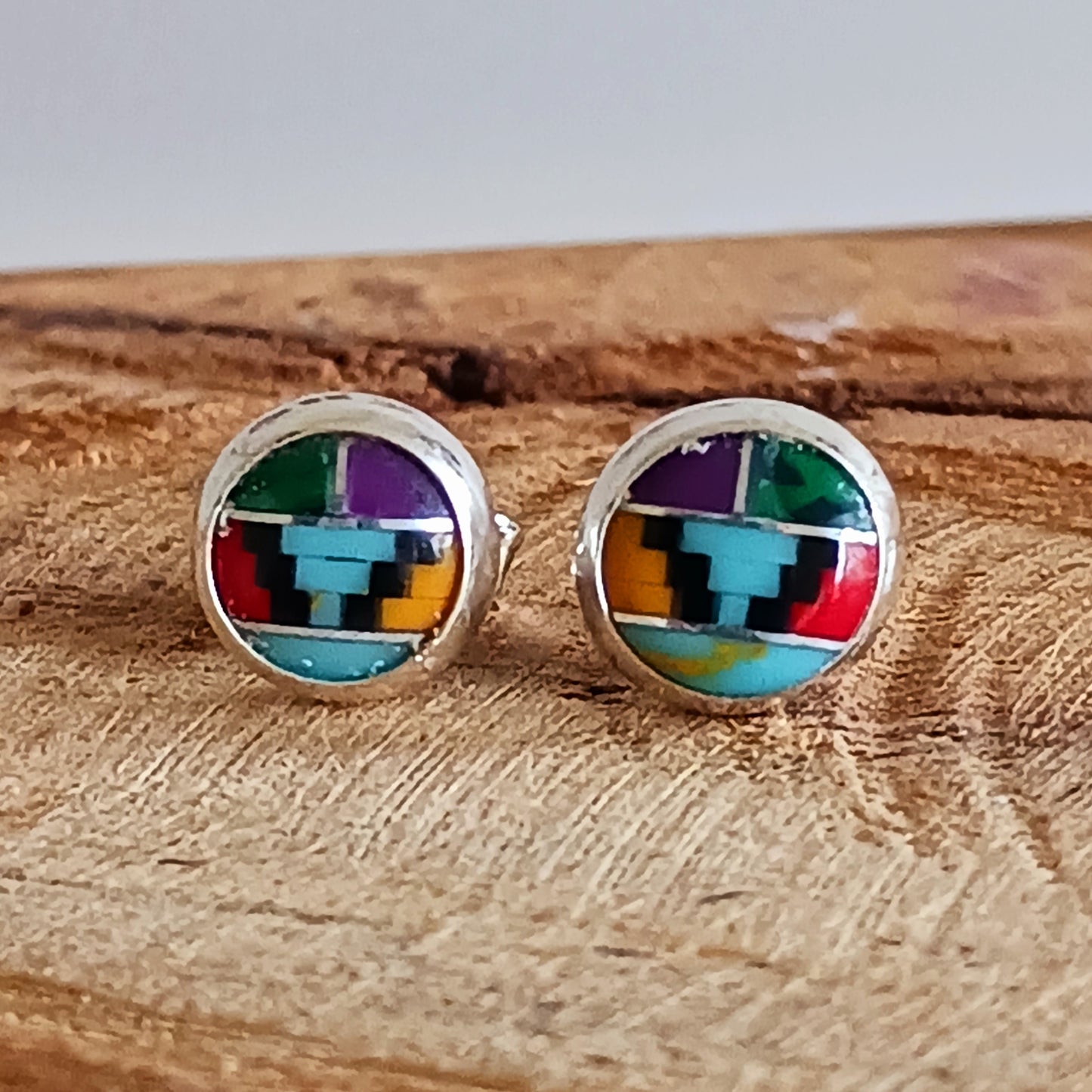 These little earrings are decorated in a colourful Aztec motif. These handmade stud earrings are unique. Each earring is a miniature work of art, with the intricate design and colours carefully handcrafted.