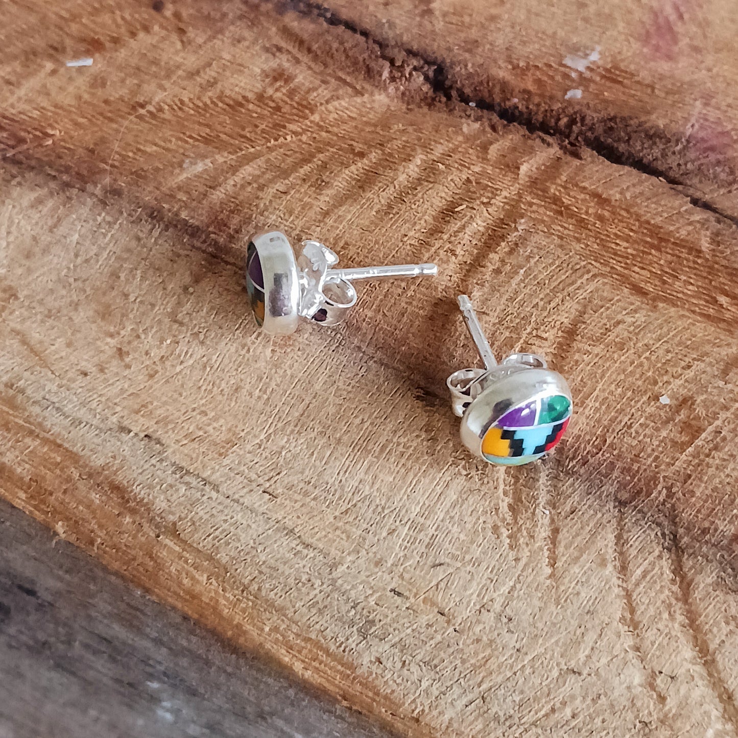 These little earrings are decorated in a colourful Aztec motif. These handmade stud earrings are unique. Each earring is a miniature work of art, with the intricate design and colours carefully handcrafted.