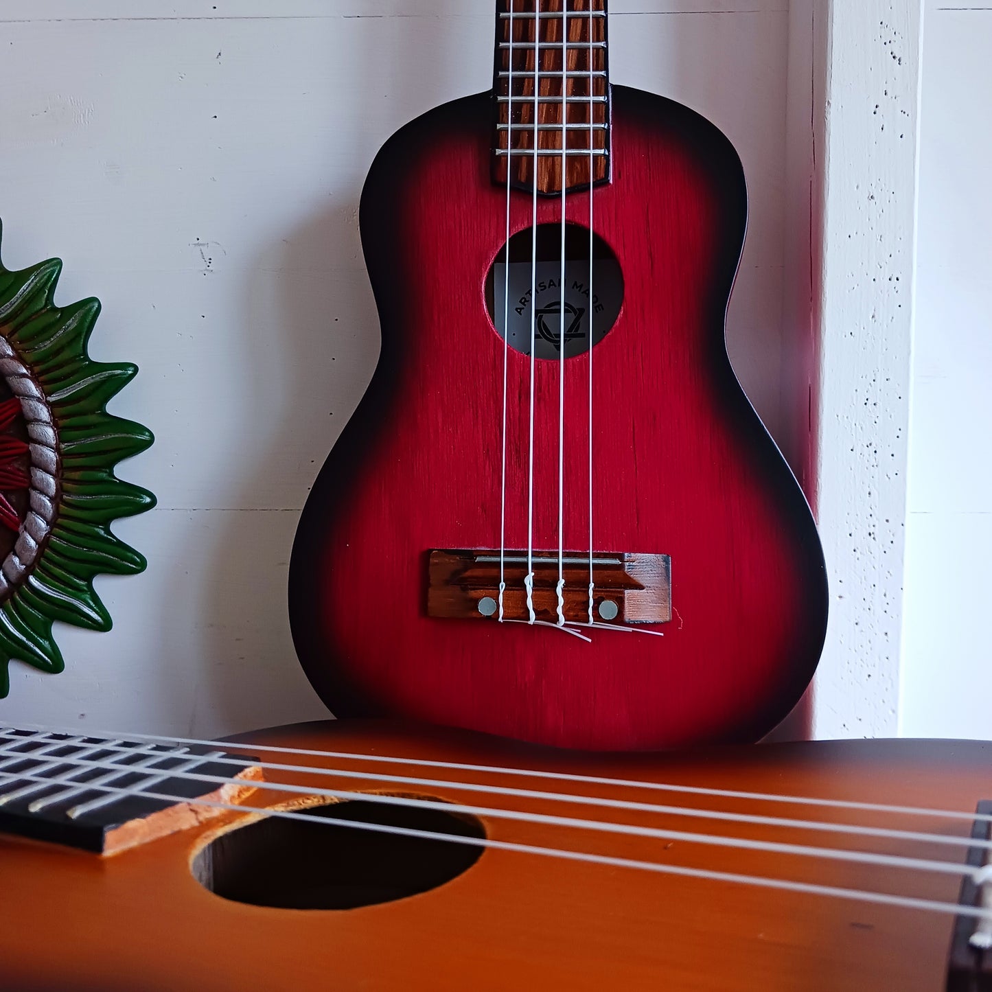 These handmade Artisan Ukuleles are beautifully handcrafted instruments from Indonesia. Featuring a natural sunburst finish, these 4-string ukuleles combine exceptional quality with vibrant visual appeal. Their high-quality construction ensures warm, resonant tones that are perfect for a variety of musical styles.