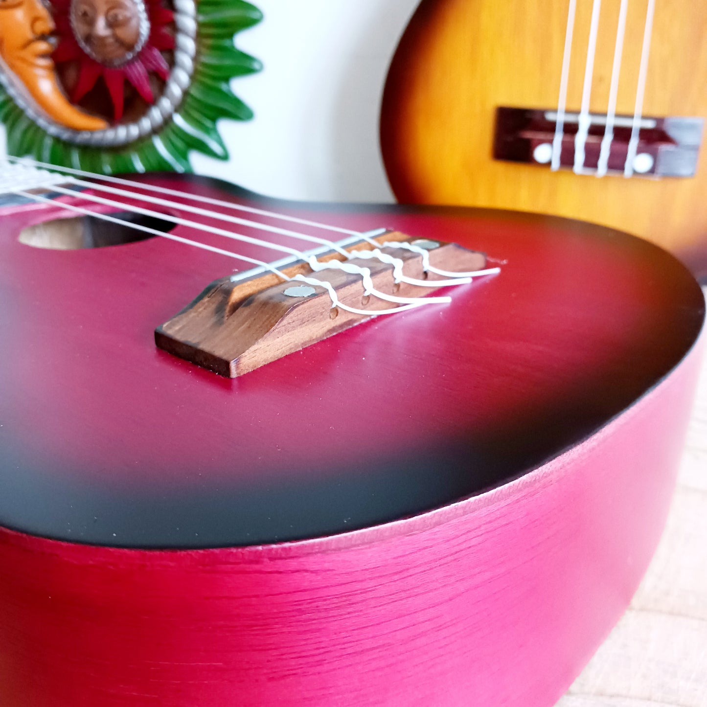 These handmade Artisan Ukuleles are beautifully handcrafted instruments from Indonesia. Featuring a natural sunburst finish, these 4-string ukuleles combine exceptional quality with vibrant visual appeal. Their high-quality construction ensures warm, resonant tones that are perfect for a variety of musical styles.