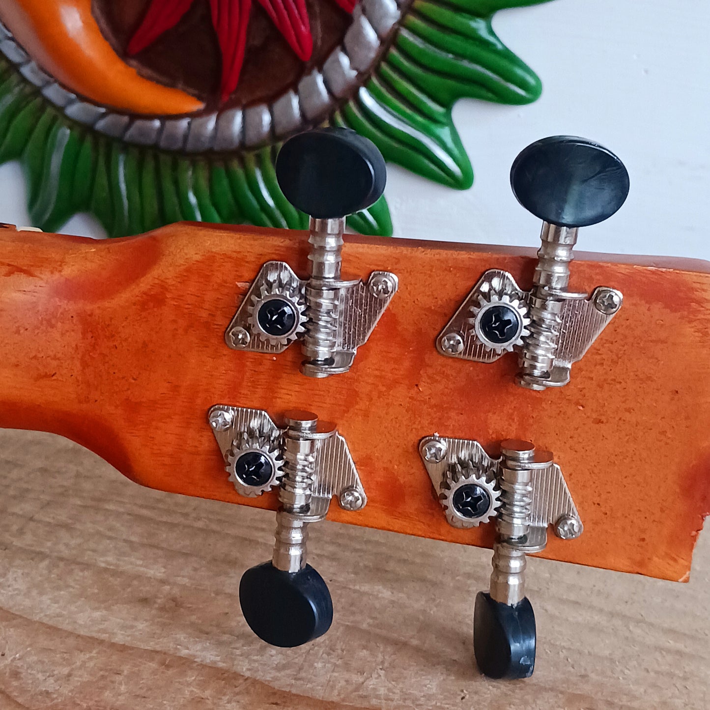 These handmade Artisan Ukuleles are beautifully handcrafted instruments from Indonesia. Featuring a natural sunburst finish, these 4-string ukuleles combine exceptional quality with vibrant visual appeal. Their high-quality construction ensures warm, resonant tones that are perfect for a variety of musical styles.