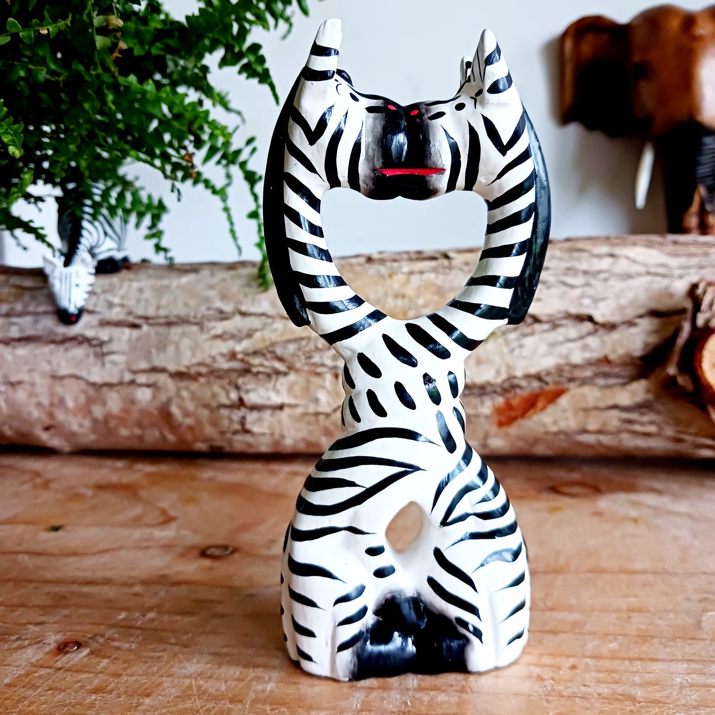 These cartoon kissing zebras make a fun, cute couple! They are handcarved and painted and make a great little gift for animal fans.