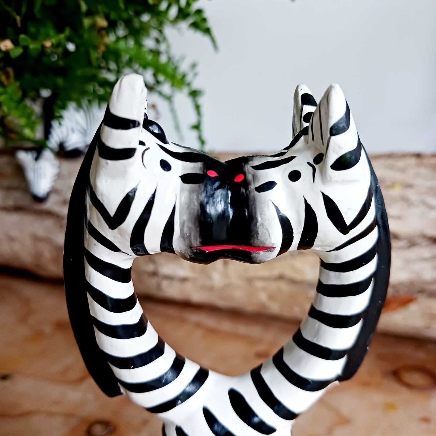 These cartoon kissing zebras make a fun, cute couple! They are handcarved and painted and make a great little gift for animal fans.