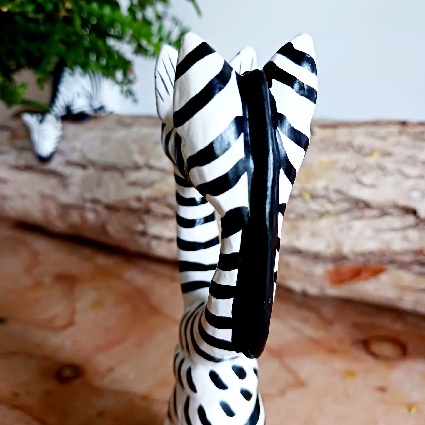 These cartoon kissing zebras make a fun, cute couple! They are handcarved and painted and make a great little gift for animal fans.