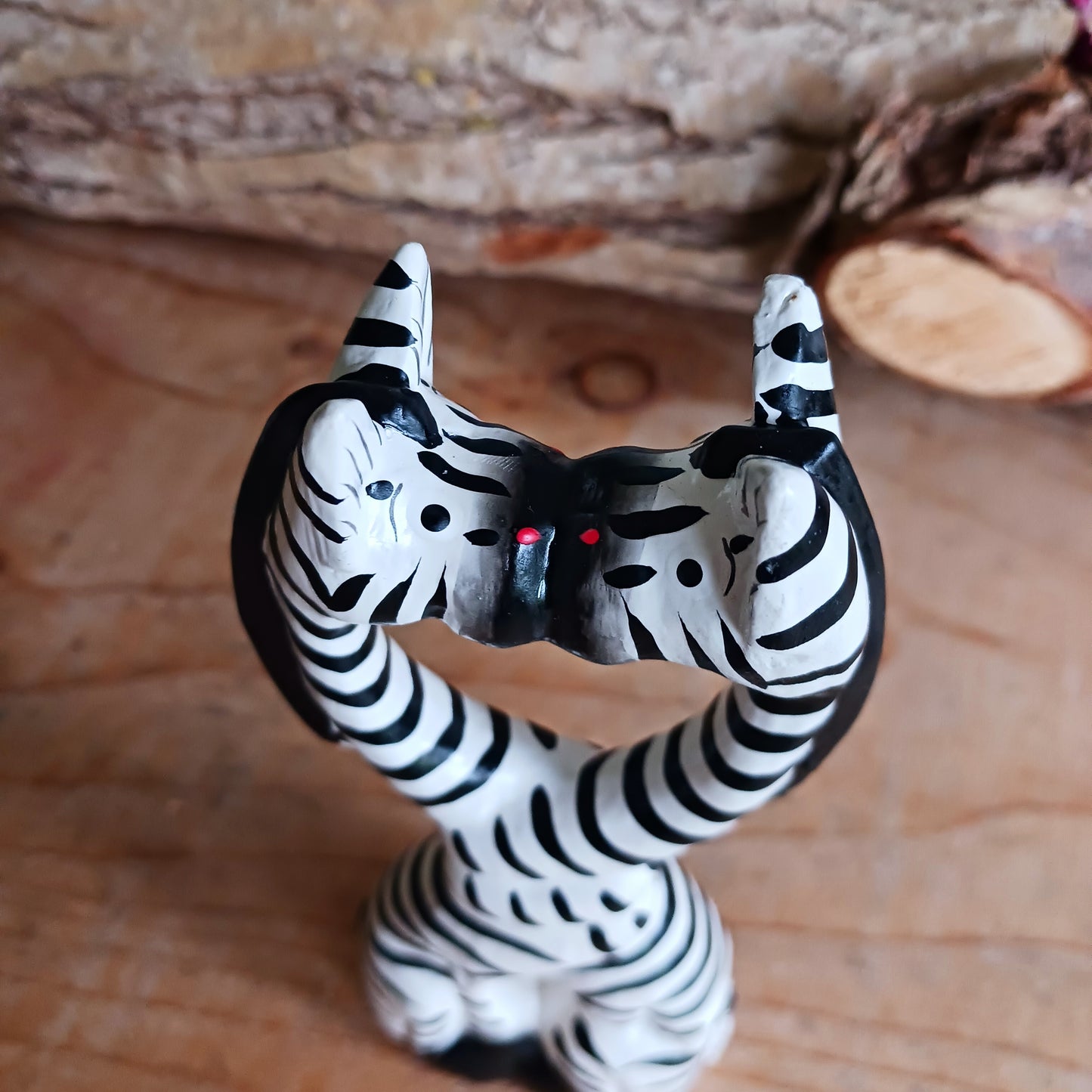 These cartoon kissing zebras make a fun, cute couple! They are handcarved and painted and make a great little gift for animal fans.
