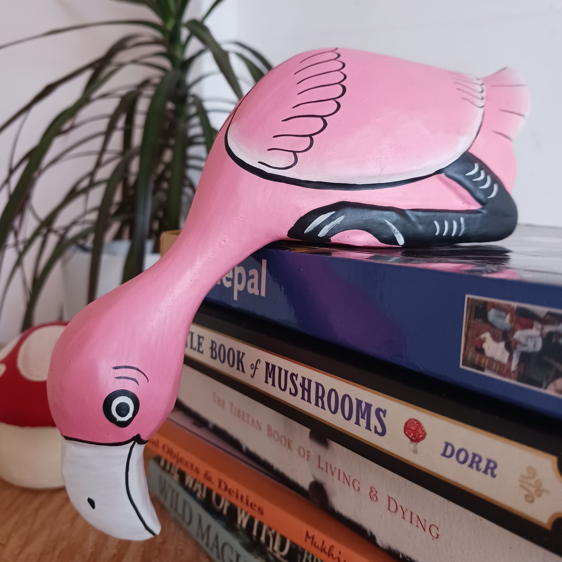 Exhibit this delightful handpainted flamingo on a shelf or your desk for a very bright and colourful display. Made using Albesia wood which is fast growing and sustainable.