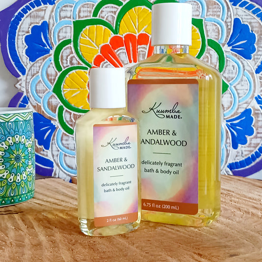 Woody, rich, spicy and earthy with a hint of citrus - a deeply sensual and inviting fragrance that celebrates the gift of the trees. This fast absorbing Amber & Sandalwood versatile Bath and Body Oil is packed with moisturizing agents that leave skin and hair radiant, healthy and softly aromatic. Use for daily moisturizing, a lavish massage, a nourishing bath, and as a deep conditioning hair treatment. Made with organic ingredients.
