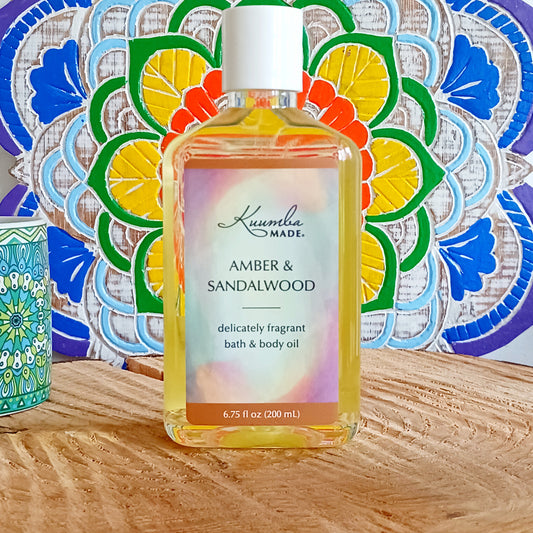 Woody, rich, spicy and earthy with a hint of citrus - a deeply sensual and inviting fragrance that celebrates the gift of the trees. This fast absorbing Amber & Sandalwood versatile Bath and Body Oil is packed with moisturizing agents that leave skin and hair radiant, healthy and softly aromatic. Use for daily moisturizing, a lavish massage, a nourishing bath, and as a deep conditioning hair treatment. Made with organic ingredients.
