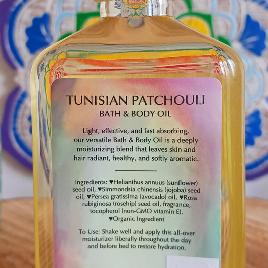A unique, rich, slightly sweet and well balanced patchouli. Warms the heart, grounds the senses, this fast absorbing Tunisian Patchouli versatile Bath and Body Oil is packed with moisturizing agents that leave skin and hair radiant, healthy and softly aromatic. Use for daily moisturizing, a lavish massage, a nourishing bath, and as a deep conditioning hair treatment. Made with organic ingredients.